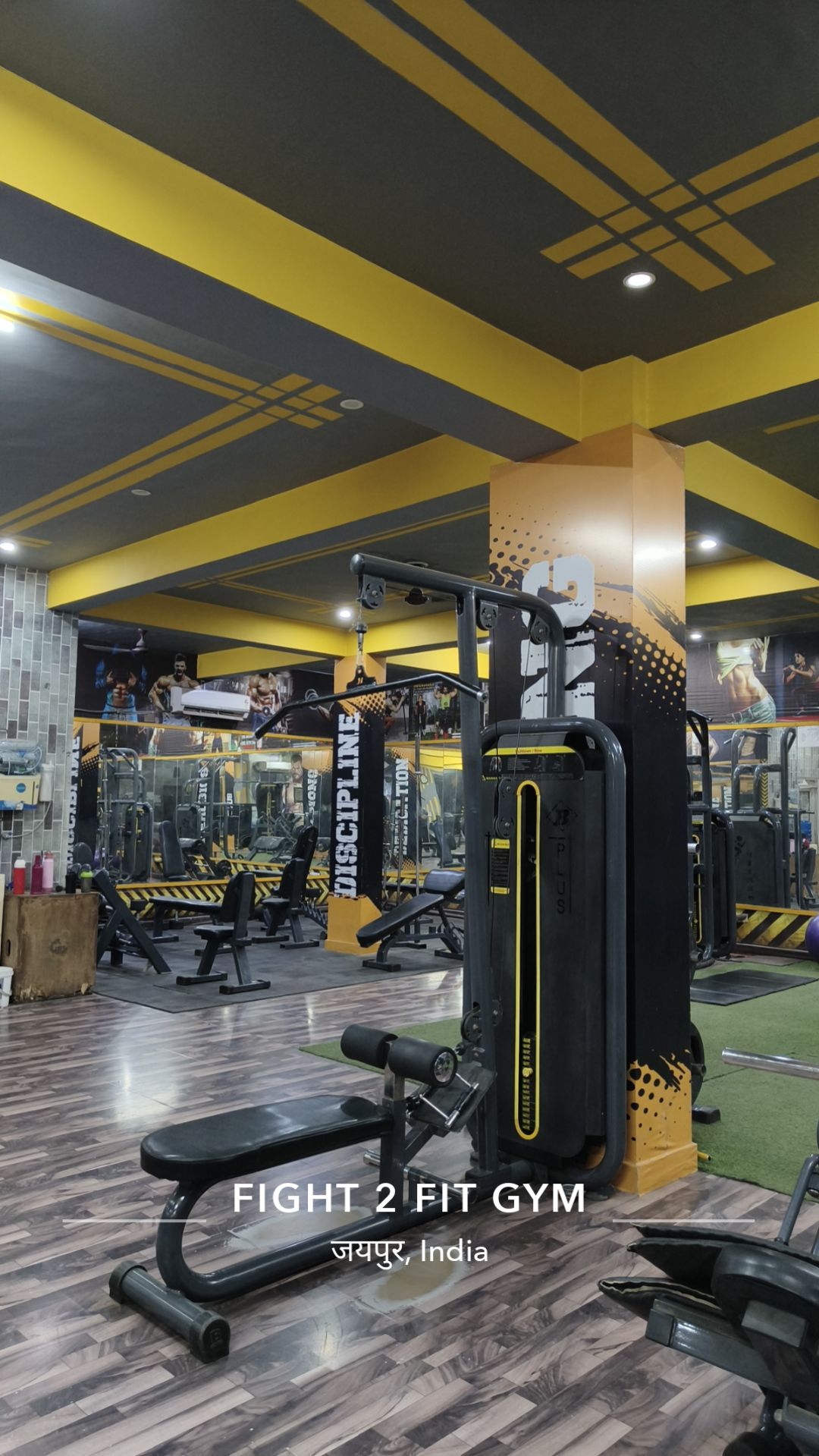 Fight 2 Fit Gym interior with signature black-and-yellow training floor